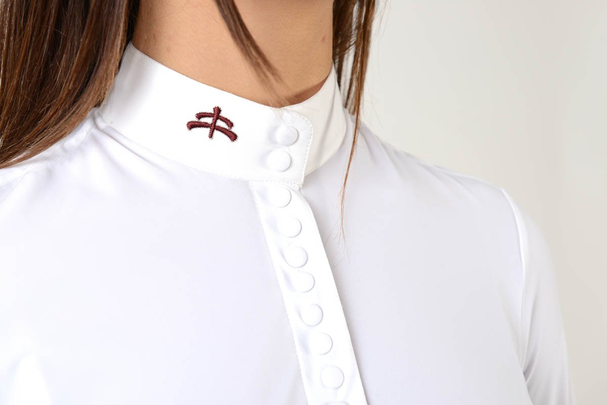 Ladies long sleeve shirt | model DAFNE | buttons | Ladies long sleeve polo shirt | lady long sleeve polo shirt | cotton | long sleeves polo shirt | long sleeves shirt | long sleeves riding polo | lady polo | lady riding shirt | riding shirt | ladies riding shirt | comfort of movement | Makebe | clothing | equestrian | riding | technical material | made in Italy | elegance | white |
