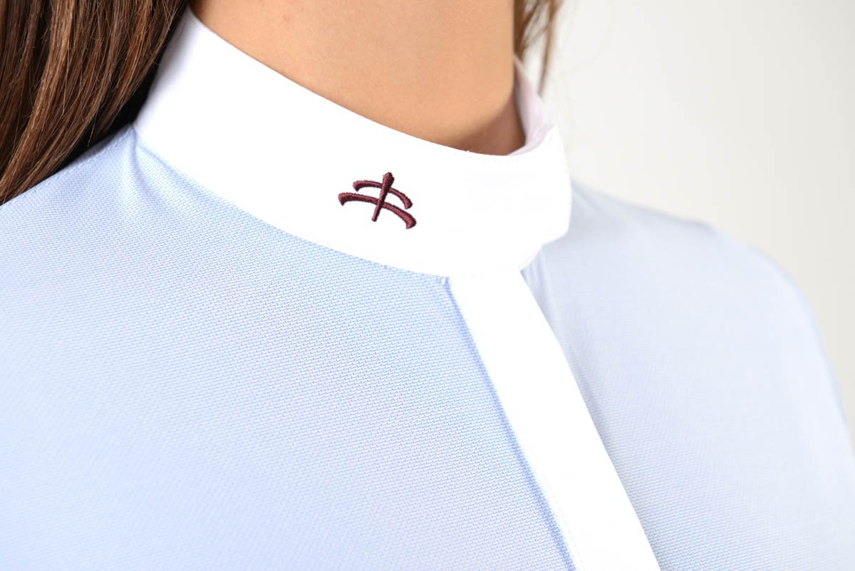 Ladies long sleeve shirt | technical fabric | lady long sleeve shirt | long sleeves shirt | long sleeves shirt | model SOFIA | long sleeves riding shirt | lady polo | lady riding shirt | riding shirt | ladies riding shirt | comfort of movement | Makebe | clothing | equestrian | riding | technical material | made in Italy | elegance | light blue |