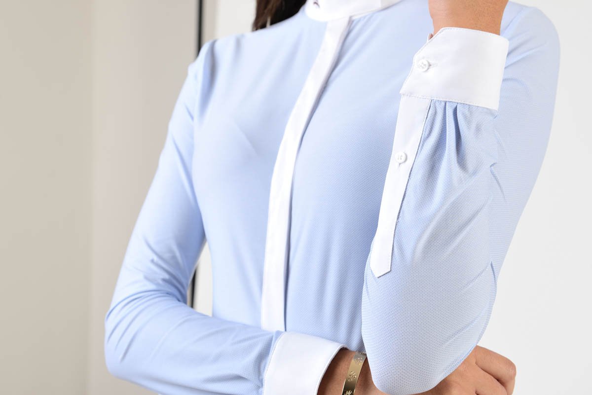 Ladies long sleeve shirt | technical fabric | lady long sleeve shirt | long sleeves shirt | long sleeves shirt | model SOFIA | long sleeves riding shirt | lady polo | lady riding shirt | riding shirt | ladies riding shirt | comfort of movement | Makebe | clothing | equestrian | riding | technical material | made in Italy | elegance | light blue |